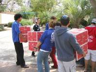 Youth movement volunteers carried the boxes of goodies into Shaar Hanegev